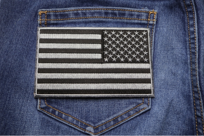 Black and Gray American REVERSED Flag Patch shown on jeans