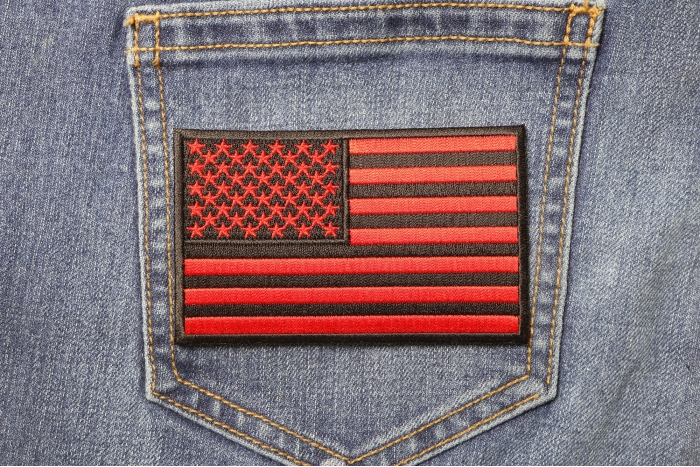 Black and Red American Flag Patch 4 Inch shown on jeans