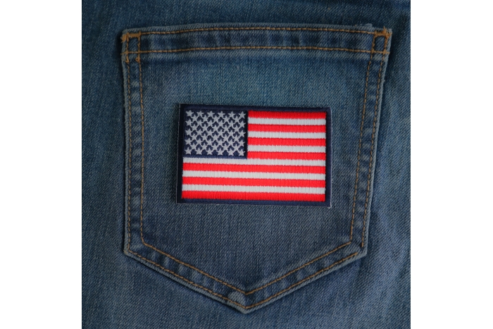 Blue Border American Flag Patch shown on jeans