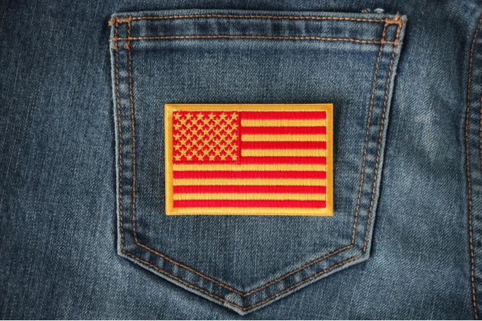 Red and Yellow US Flag Patch shown on jeans
