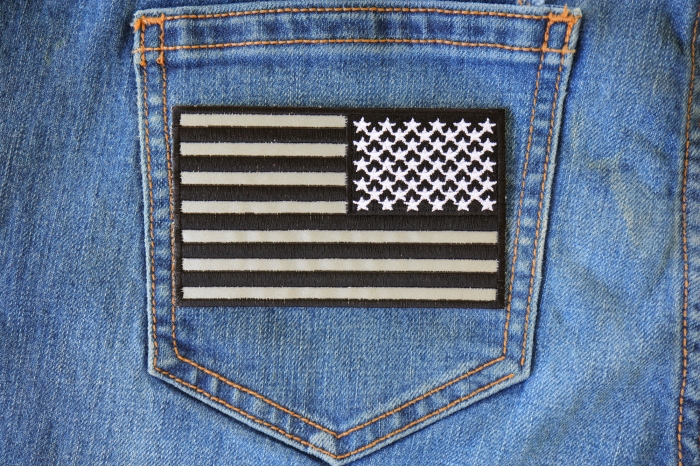 Reflective American Flag Patch Reversed 4 inch Wide shown on jeans