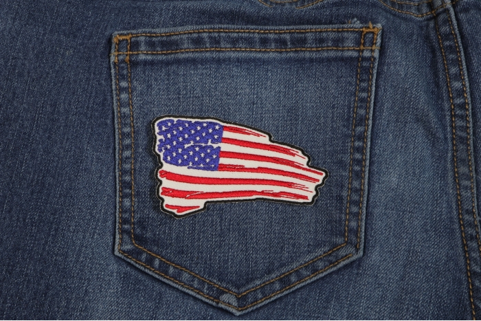 Tattered US Flag Patch Red White Blue shown on jeans