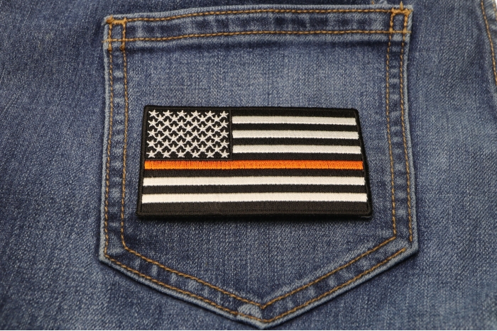Thin Orange Line American Flag For Search & Rescue shown on jeans