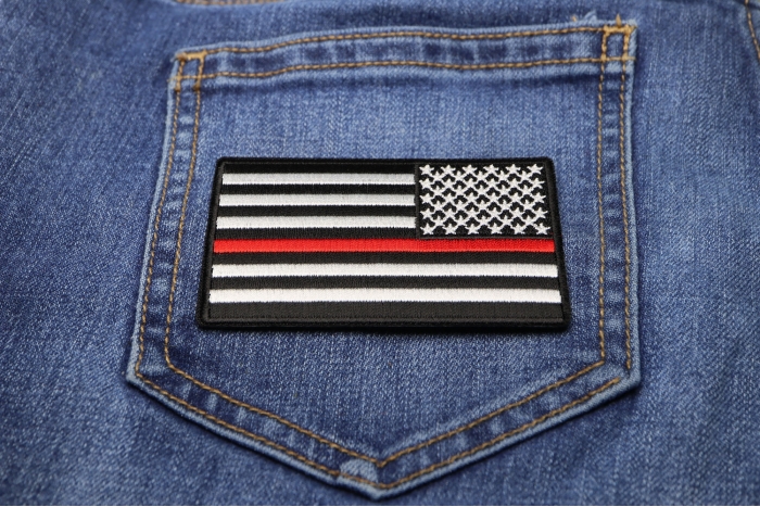 Thin Red Line American Flag Reversed Patch shown on jeans