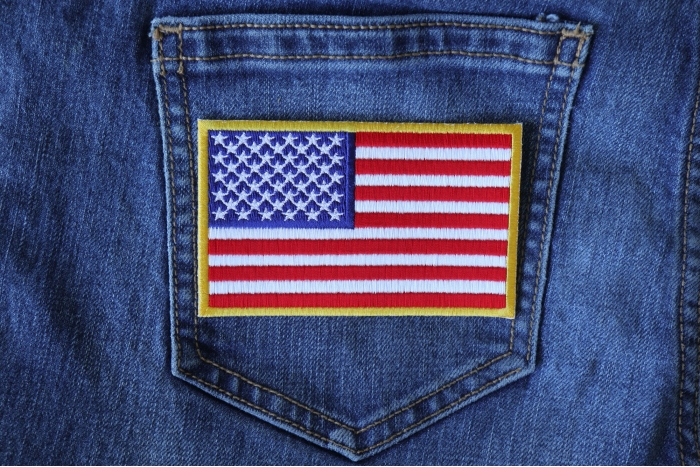 US Flag Patch 4 Inch Yellow Border shown on jeans