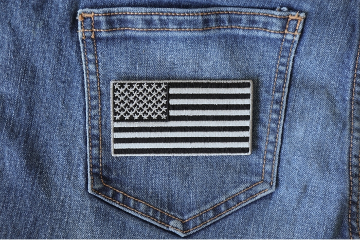 US Flag Patch Black and Gray 3.5 Inch shown on jeans