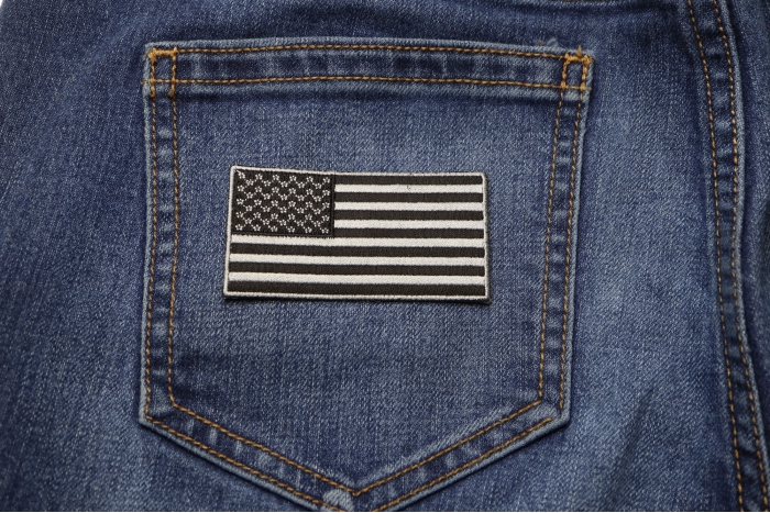 US Flag Patch Black and Gray 3 Inch shown on jeans