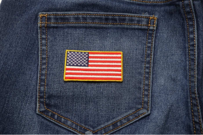 US Flag Patch Gold Border 2.5 Inch shown on jeans