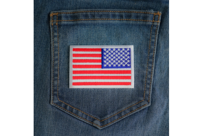 White Border Reversed American Flag Patch shown on jeans