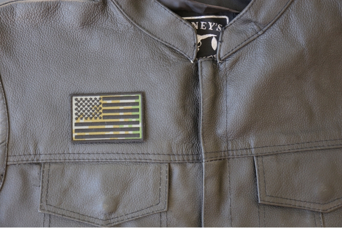 American Flag Camo Patch - 3x2 inch - Embroidered Iron on Patch shown on leather vest