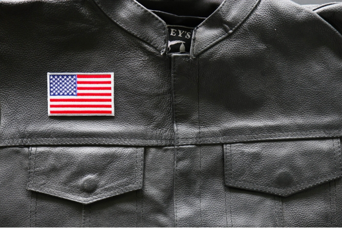 American Flag Patch Silver Border - 3x2 inch. Embroidered Iron on Patch shown on leather vest