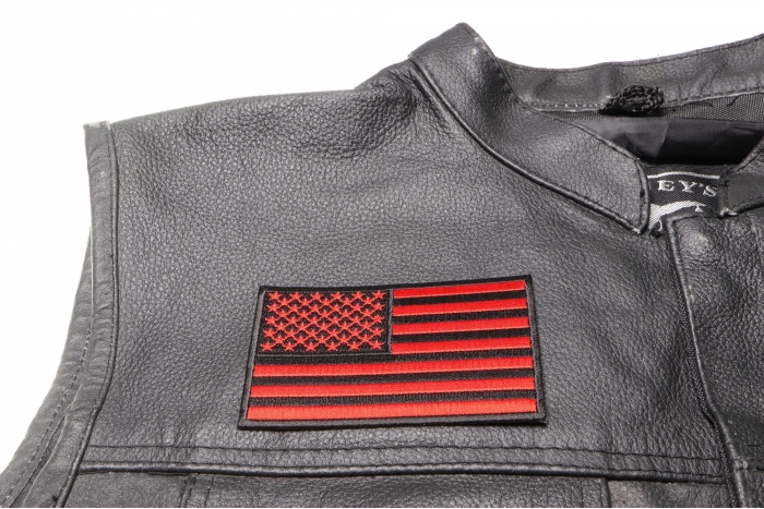 Black and Red American Flag Patch 4 Inch - 4x2.5 inch. Embroidered Iron on Patch shown on leather vest