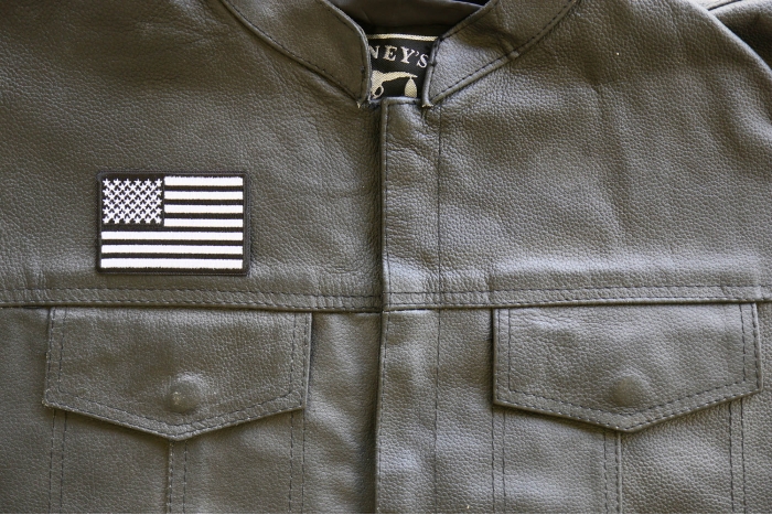 Black and White American Flag Patch shown on leather vest