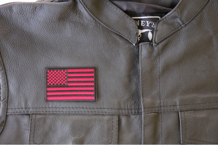 Red Black American Flag Patch - 3x2 inch. Embroidered Iron on Patch shown on leather vest