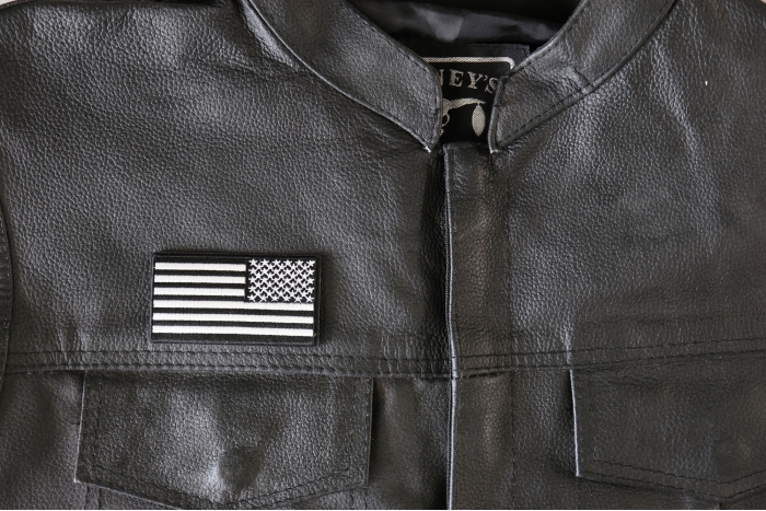 Reversed black and white 3 inch American Flag Patch - 3x1.6 inch - Embroidered Iron on Patch shown on leather vest