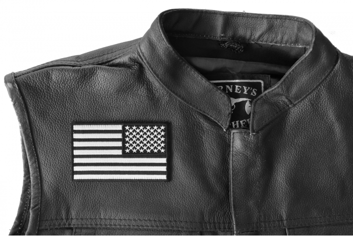 Reversed US Flag Black White Patch 4 Inch - 4x2.5 inch. Embroidered Iron on Patch shown on leather vest