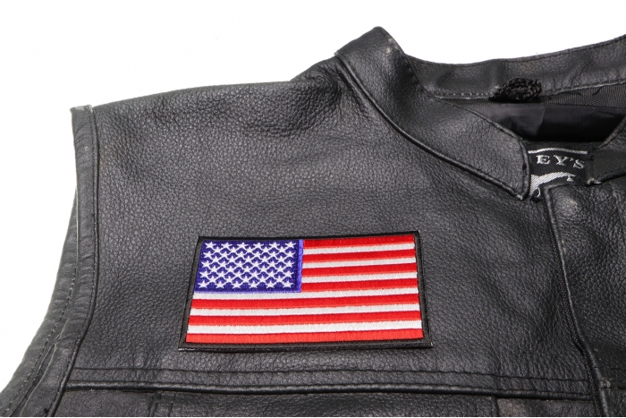US Flag Patch 4 Inch Black Border - 4x2.5 inch. Embroidered Iron on Patch shown on leather vest