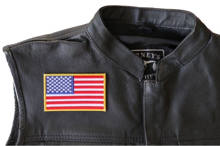US Flag Patch 4 Inch Yellow Border - 4x2.5 inch. Embroidered Iron on Patch shown on leather vest