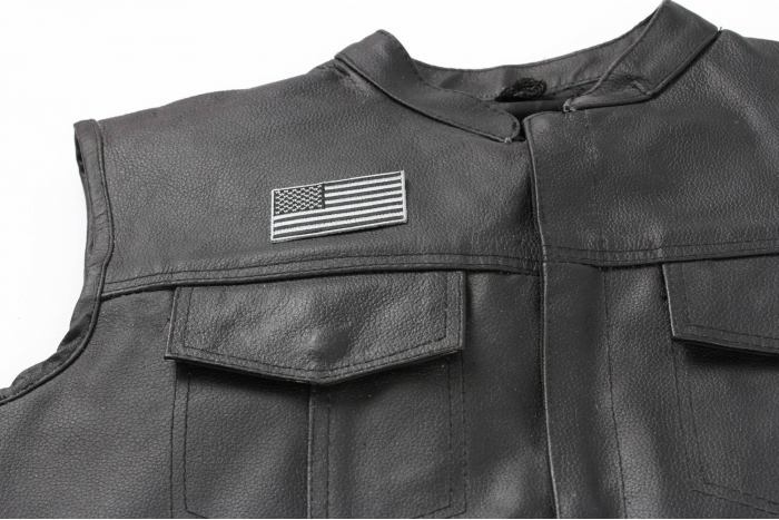 US Flag Patch Black and Gray 2.5 Inch - 2.5x1.4 inch. Embroidered Iron on Patch shown on leather vest