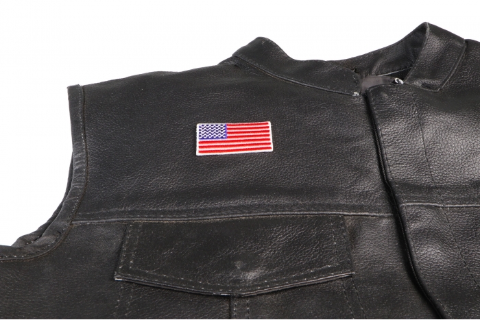 US Flag Patch White Border 2 Inch - 2x1.1 inch. Embroidered Iron on Patch shown on leather vest