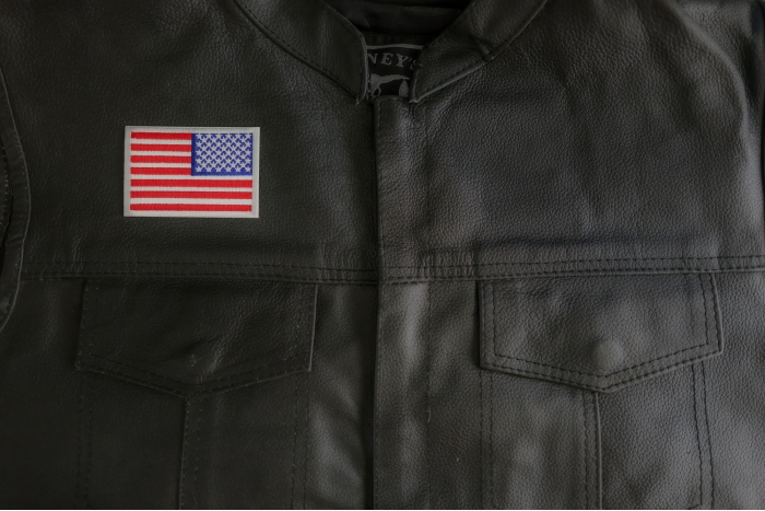 White Border Reversed American Flag Patch shown on leather vest