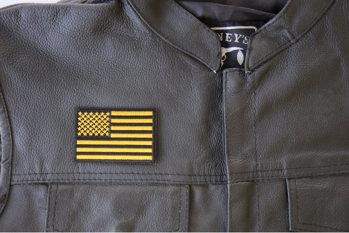 Yellow Black American Flag Patch - 3x2 inch. Embroidered Iron on Patch shown on leather vest