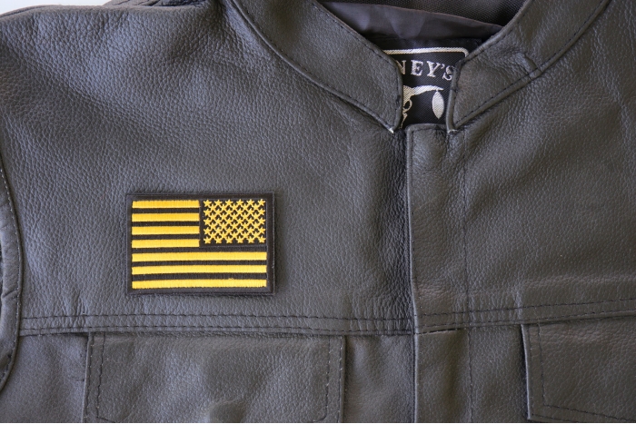 Yellow Black American Flag Reversed Patch - 3x2 inch. Embroidered Iron on Patch shown on leather vest