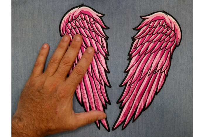Angel Wing Patch shown on hand for size comparison