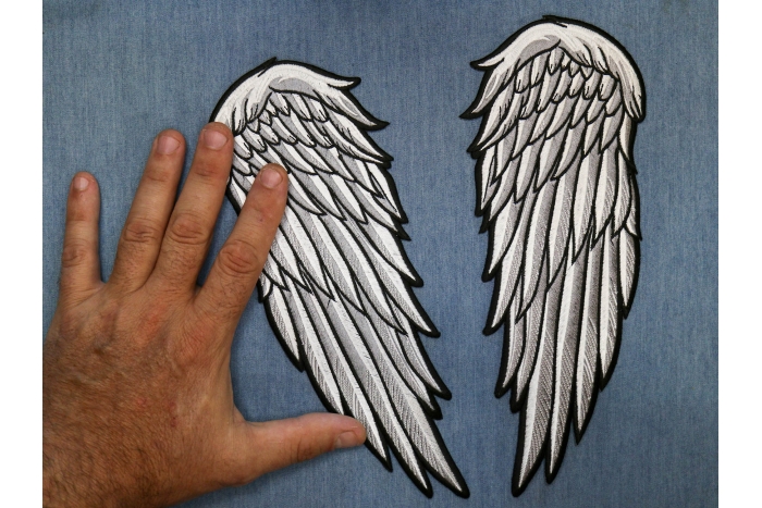 Angel Wings Patch shown on hand for size comparison