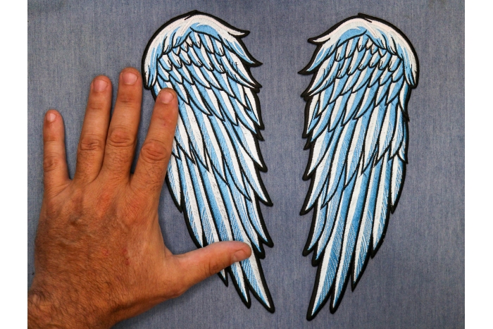 Angel Wings Patch shown on hand for size comparison