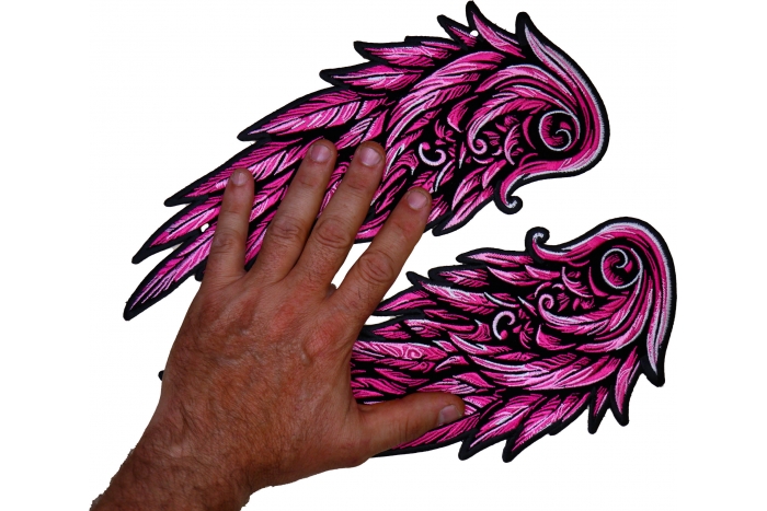 Pink Angel Wings Patch shown on hand for size comparison