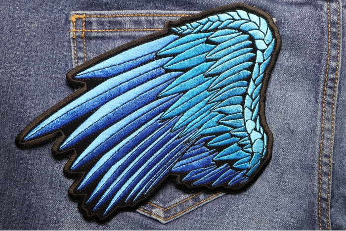Blue Left Angel Wings Patch shown on jeans