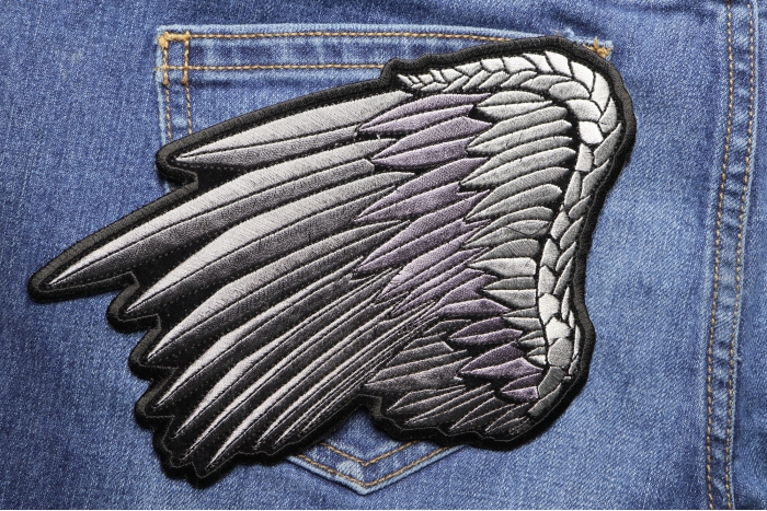 Silver Angel Wing Patch shown on jeans