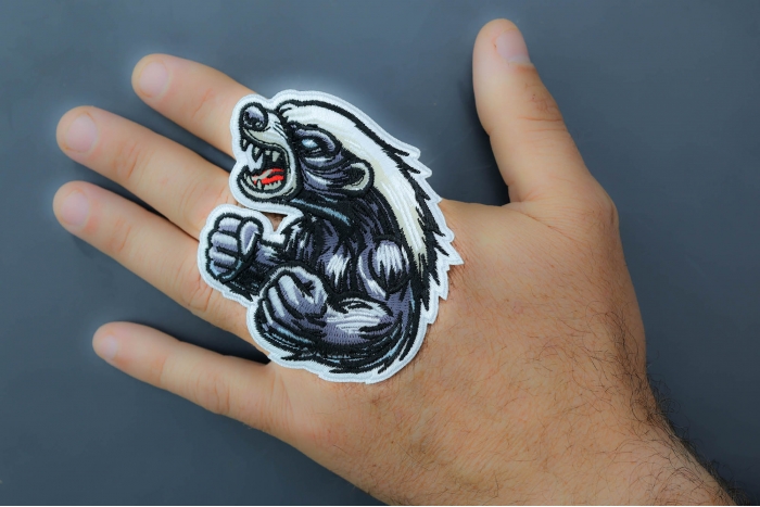 Angry Fighting Badger Patch shown on hand for size comparison
