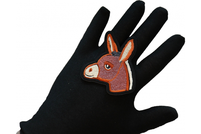 Baby Donkey Iron on Patch shown on hand for size comparison