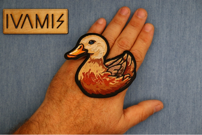 Baby Duck Patch shown on hand for size comparison