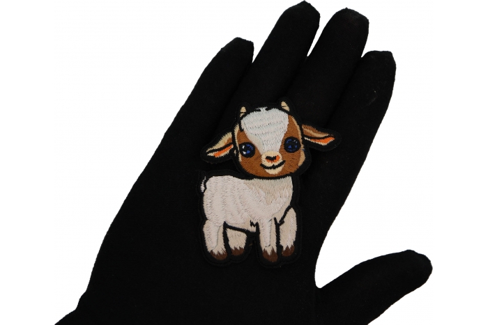 Baby Goat Patch shown on hand for size comparison