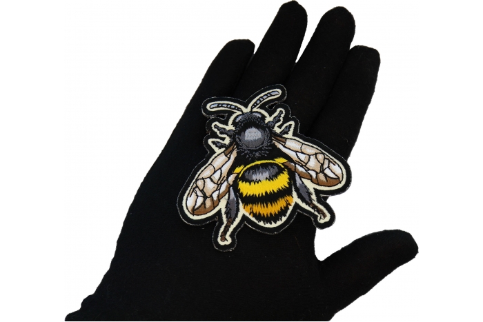 Bee Patch shown on hand for size comparison