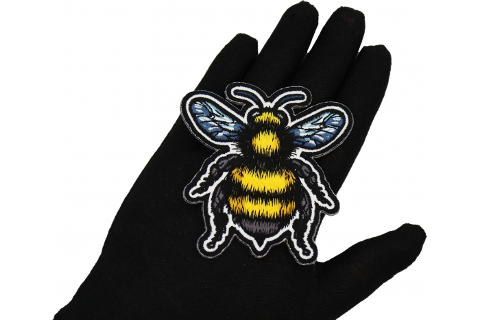 Bee Patch shown on hand for size comparison