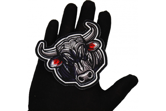 Black Bull Patch shown on hand for size comparison