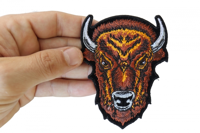 Buffalo Head Small Patch shown on hand for size comparison