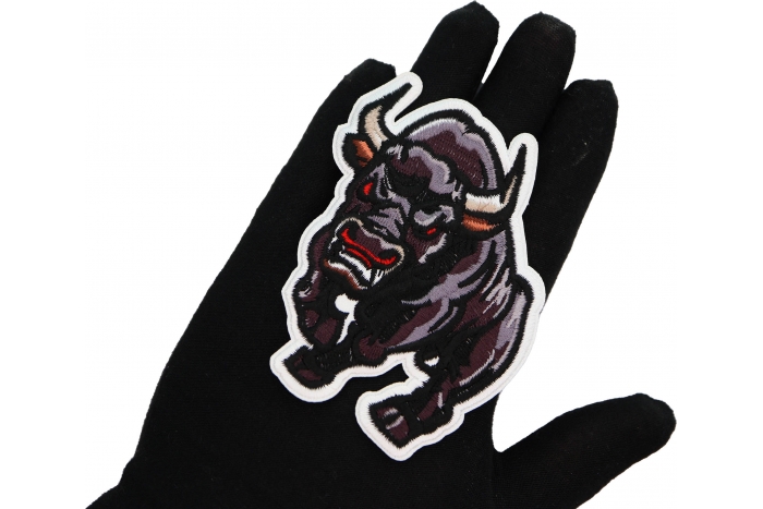 Bull Patch shown on hand for size comparison