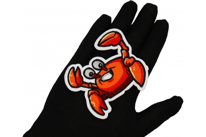 Crab Patch shown on hand for size comparison