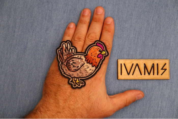 Cute Chicken Patch shown on hand for size comparison