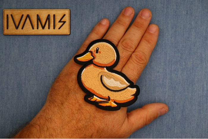 Cute Duck Patch shown on hand for size comparison