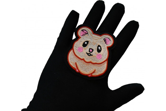 Cute Hamster Iron on Patch shown on hand for size comparison