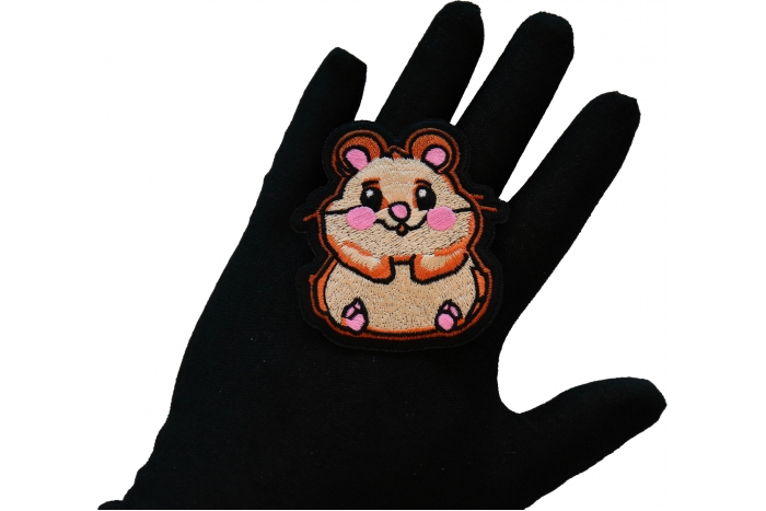 Cute Hamster Iron on Patch shown on hand for size comparison