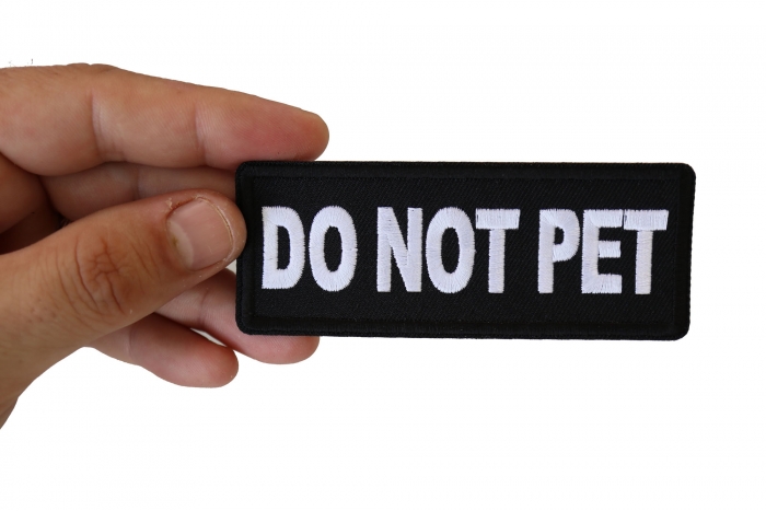 Do Not Pet Patch shown on hand for size comparison