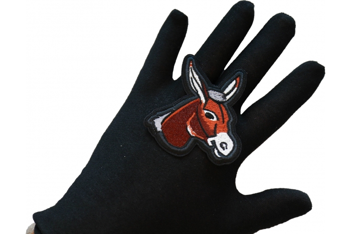 Donkey Iron on Patch shown on hand for size comparison