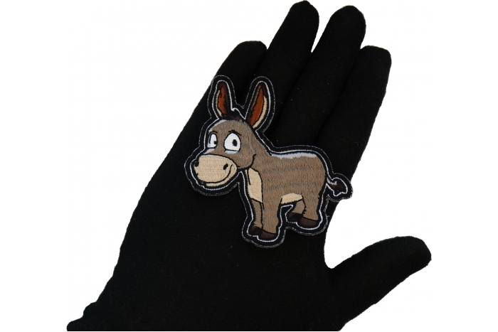 Donkey Patch shown on hand for size comparison